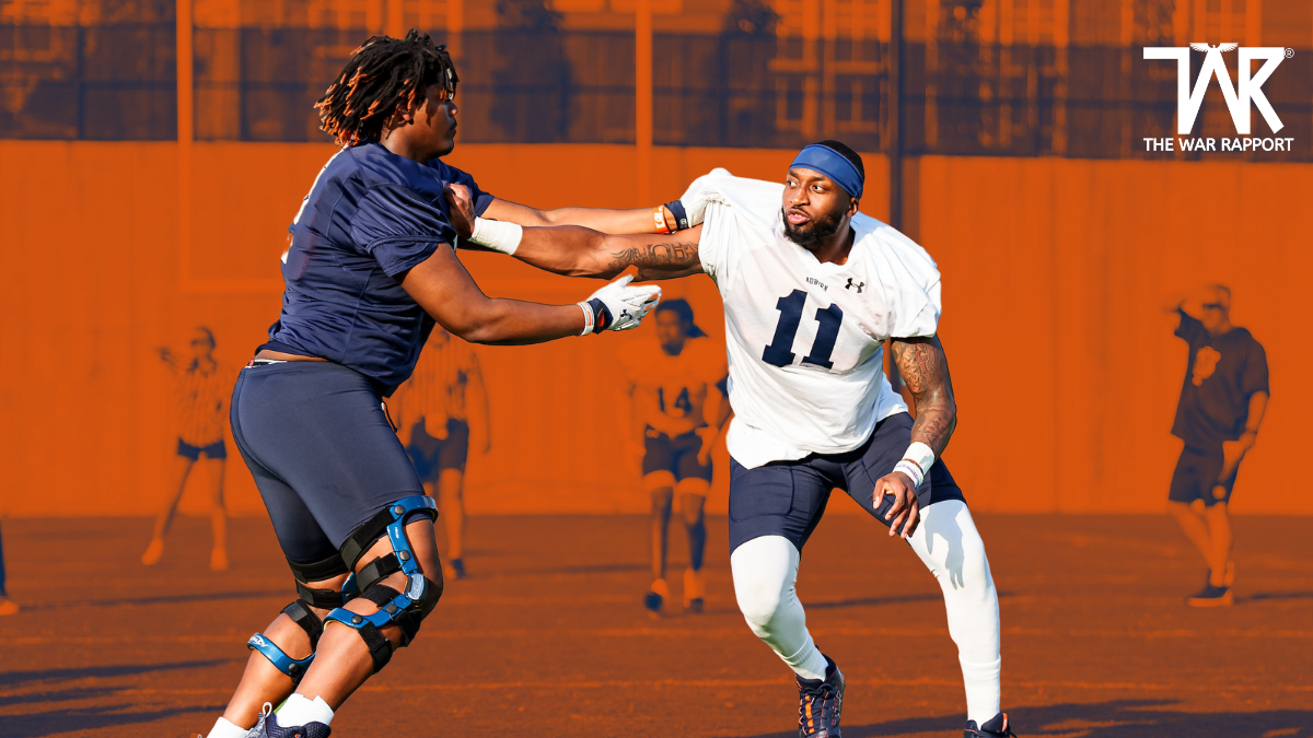 Freshman, Keldric Faulk going through drills with Senior, Elijah McAllister.